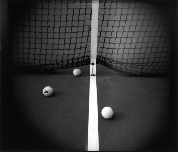 The line, the position of the three balls and the net caught my eye.