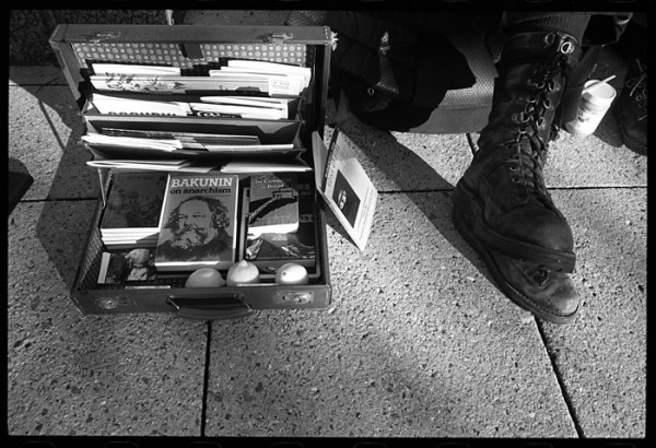 A few weeks ago I was wandering around town with film in my camera and time on my hands. This is a portrait of Rusty ("please keep my face out of the photo"). I'd call Rusty and his friend Sonia travelers. I liked the way his big boots looked next to the briefcase packed with anarchist literature and three lemons.