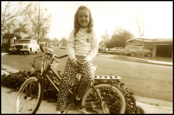 Here's one from the archives. Dig the leopard print pants and early cruiser bike. Happy Birthday Julie!