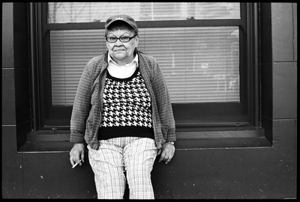 The window seat, baseball cap and black and white vest with the plaid pants caught my eye. Chatting with her was a pleasure.