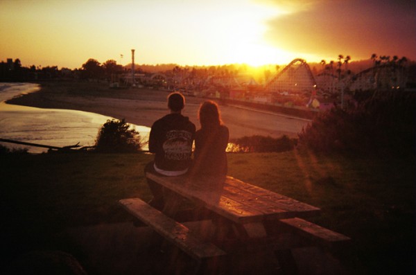 I took this one a couple of months ago. It's a quick grab shot with my Holga 135BC and Kodak 200 ISO film. I liked the couple, the beach, the Boardwalk and the light. 