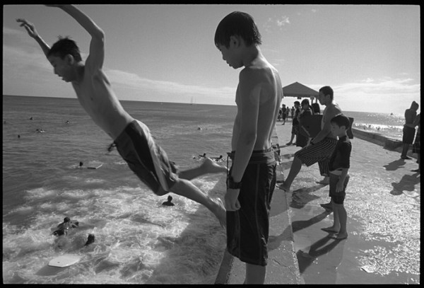 "The Walls" is one of my favorite spots to photograph around Waikiki. Local kids gather here to boogie board, jump off the jetty and hang out. In the afternoon there's always something happening.