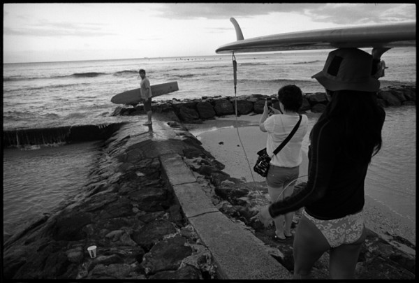 Sometimes the surf scene at Waikiki can be overwhelming. From first light to sunset surfers file into the water.