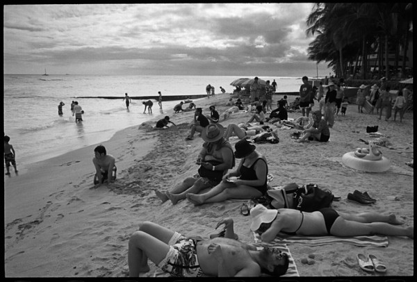 The guy in the foreground, the couple in the middle, shoes, beach toys, the light and the sky. I don't know, the scene caught my eye.