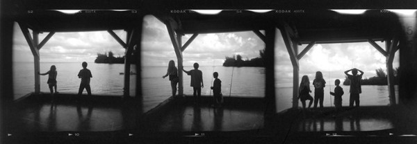 Morning on the pier, Hanalei Bay, Kauai. This is three consecutive frames on a contact sheet. The kids were watching a bird dive for fish.