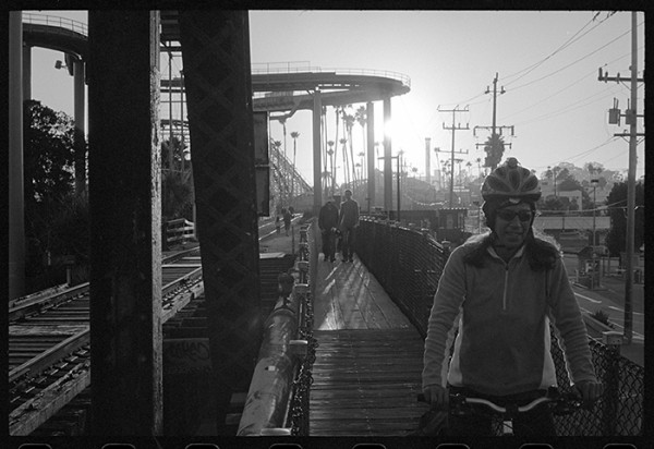 Walking, talking and snapping photos. Rush hour on the bridge over the mighty San Lorenzo River. 